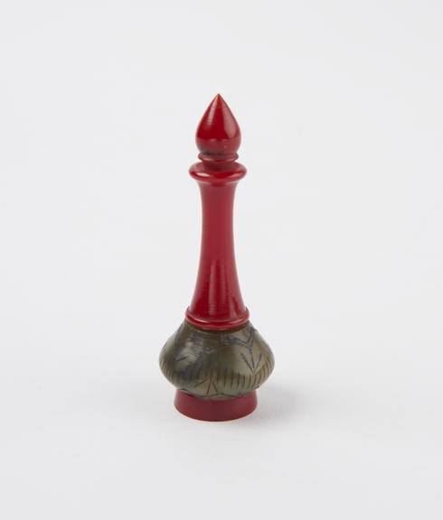 Perfume bottle, with stone oval body, with red base