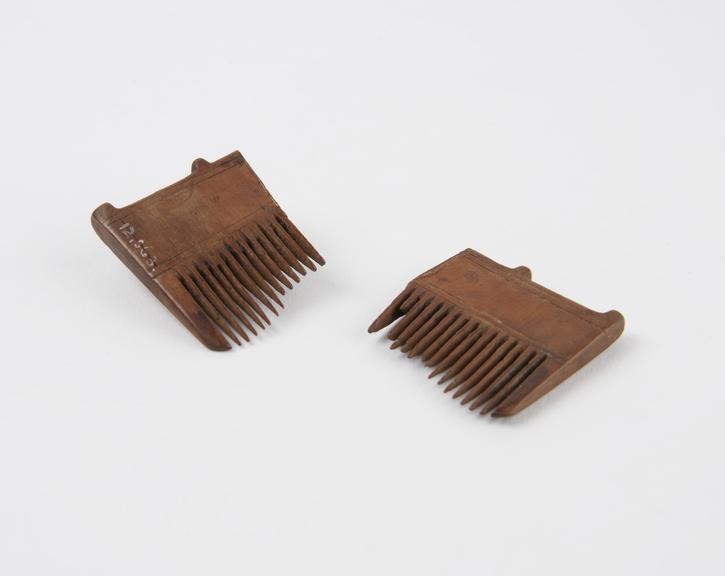 Hardwood comb, two pieces with broken teeth