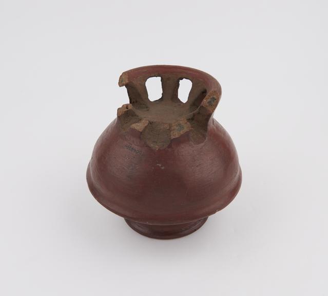 Red glazed pottery vase, hemispherical body, domed shoulders