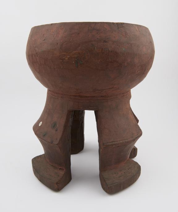 Carved wooden dish-like mortar on 4 legs which are ridged at