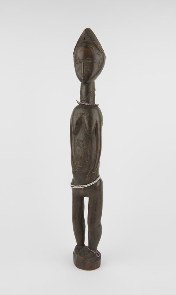 Carved wooden ancestral figure, tall, slim upright female