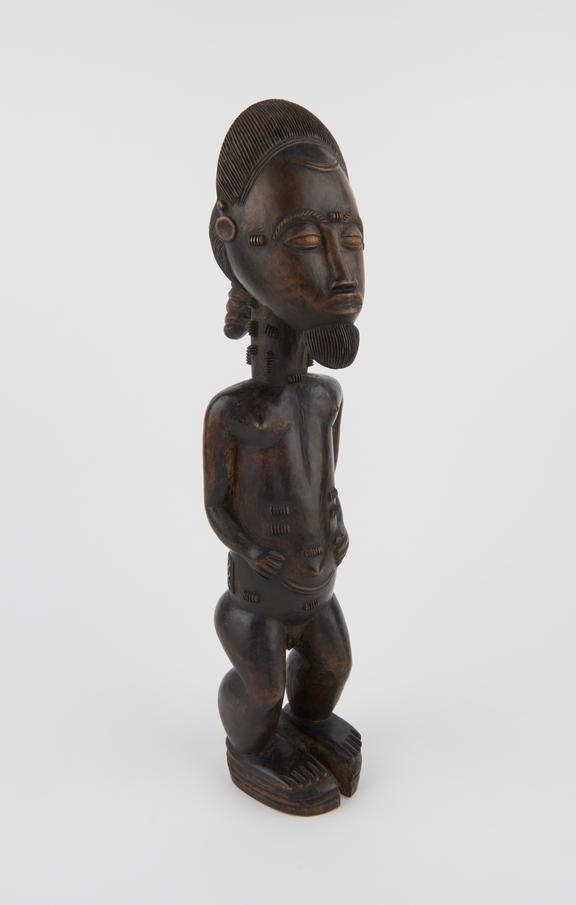 Carved wooden ancestral figure of male standing in position