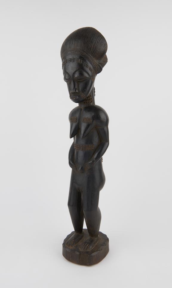 Carved wooden ancestral figure of female