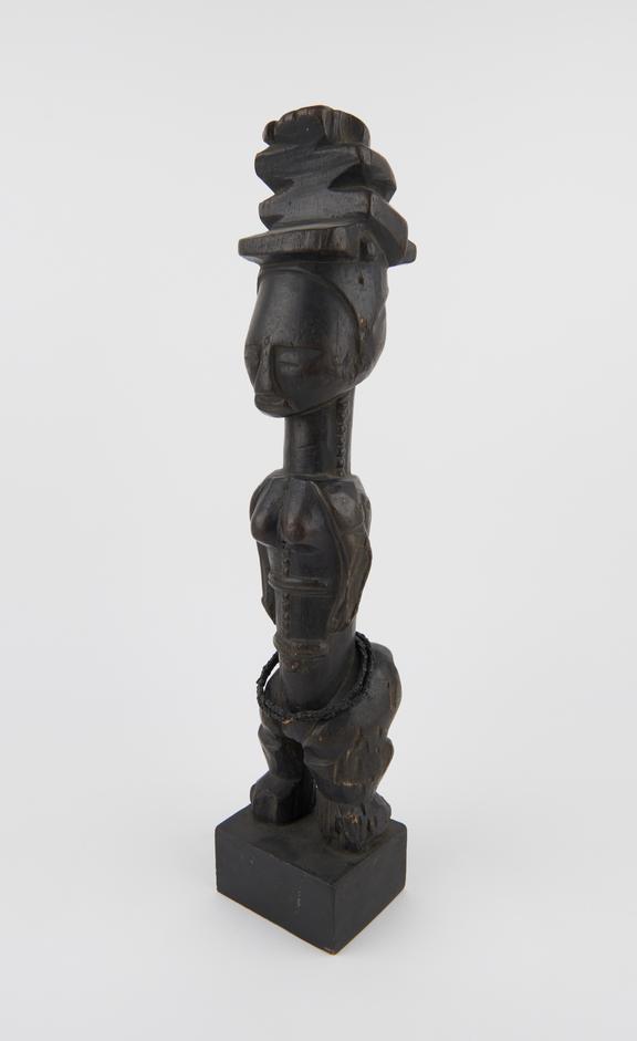 Carved ancestral figure of woman with elaborate headdress