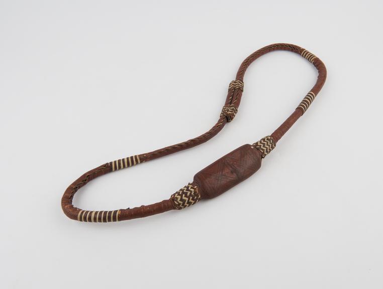 Red amuletic belt worn to prevent cholera, made by Fanti people