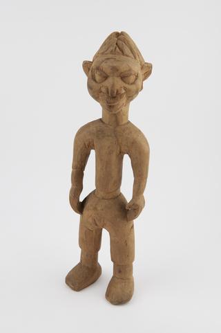 Carved wooden statuette of idol