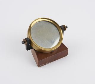 Brass framed mirror on mahogany stand, from Groth's universal apparatus