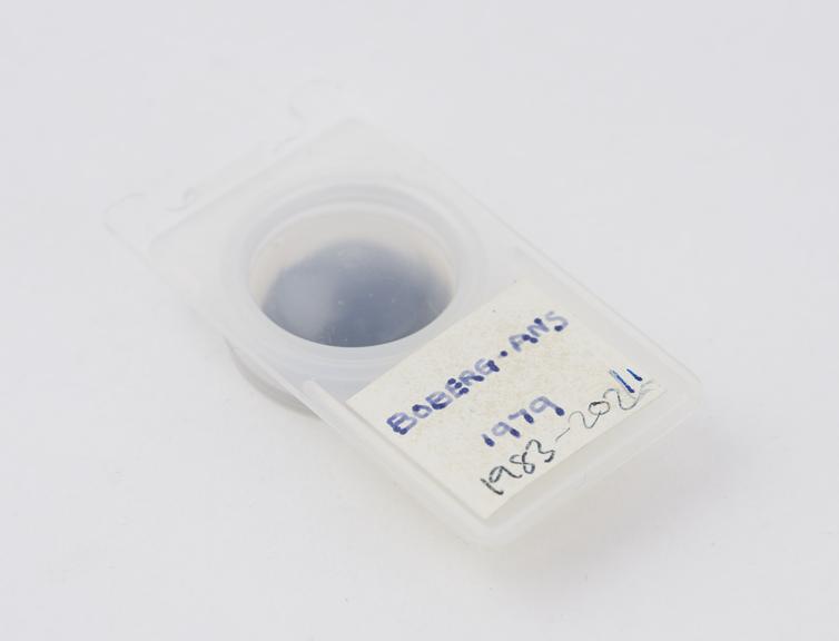 One of  eight intraocular lenses with case