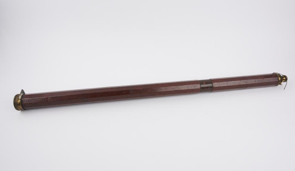 Naval telescope, one brass draw tube, decagonal mahogany body