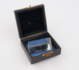 Glass prism in wooden box