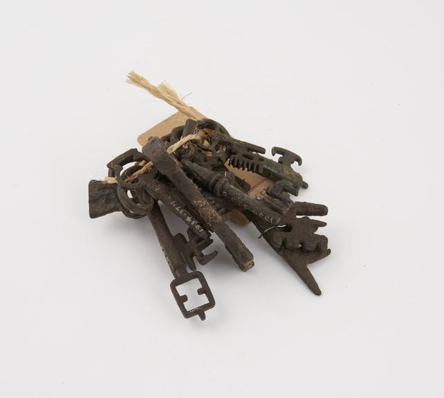 1) 14th Century bronze key with two identical wards facing each