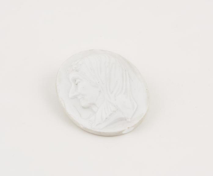 White glass plaque, with a portrait of a woman in relief