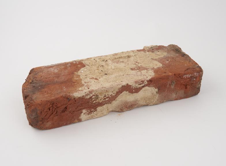 Brick used for transverse bonding in brick and flint wall