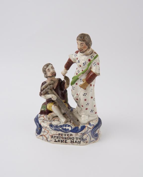 Earthenware statue depicting Saint Peter restoring the lame man