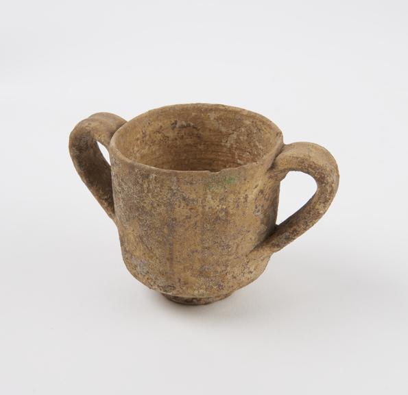 Cup, glazed, two handled, trace of painted pattern