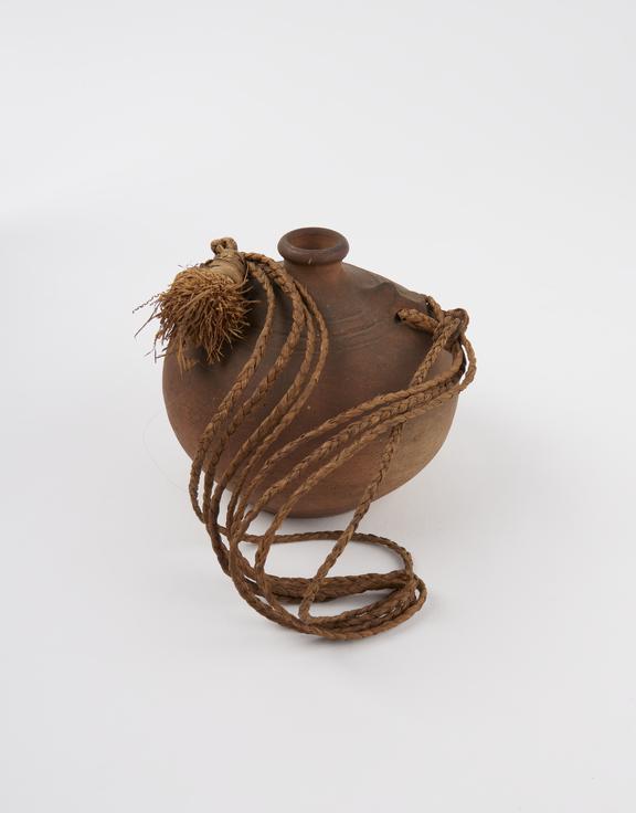 Jug, stoneware, designed for carrying, with rope