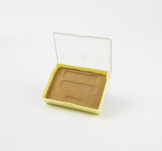 Plasticine impression of three inscriptions from oculist's seals, in plastic box