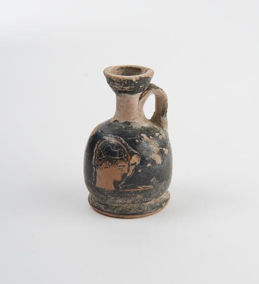 Tiny squat red-figure lekythos (bottle)