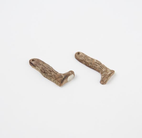 Pair of perforated terracotta legs, amuletic, votive (?)