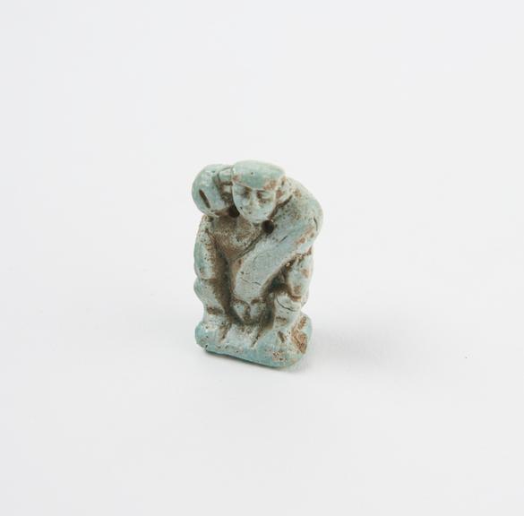 Pendant, blue glazed faience figure