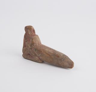 Small pottery figure of seated male leaning on priapus
