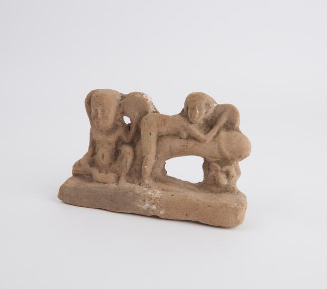 Unglazed terracotta phallic group (statue)