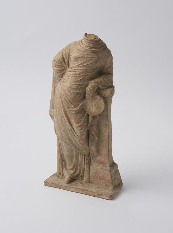 Headless statue, female, draped, holding morror, probably Greek