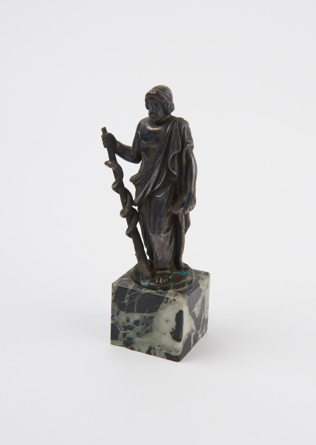 Small metal statue of Aesculapius | Science Museum Group Collection