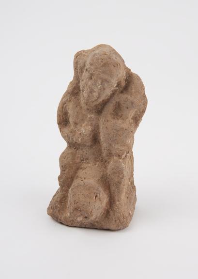 Unglazed terracotta seated phallic figure