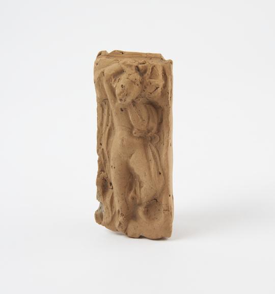 Rattle, model of infant in cradle, terracotta, Roman