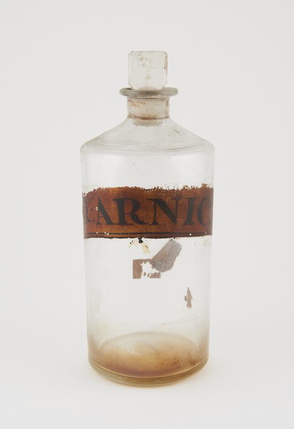Bottle, clear glass, trace contents, for tincture of arnica