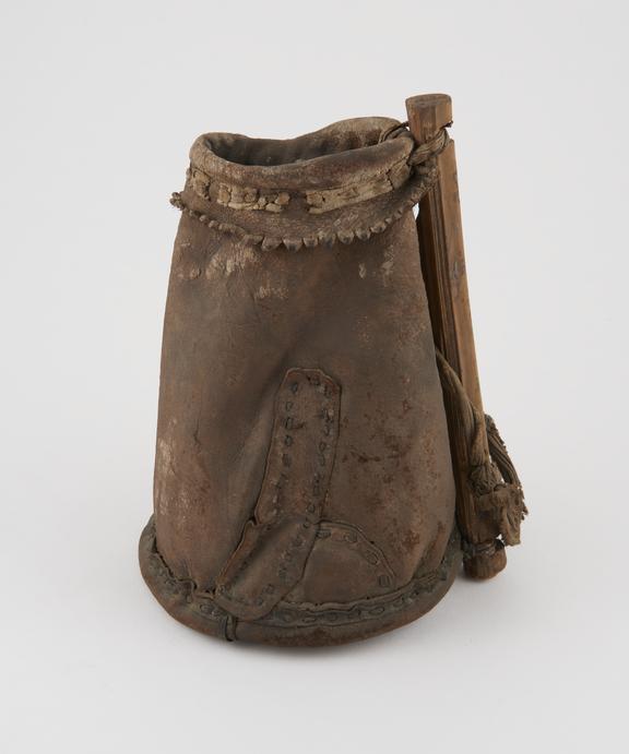 Leather jug, with wooden handle