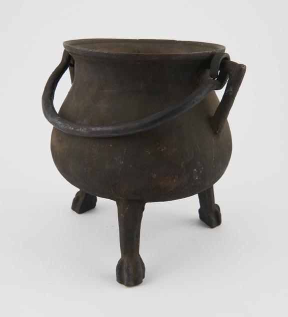 Bulbous bronze cauldron on three legs