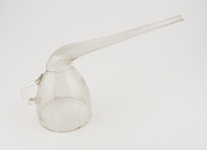 Clear glass funnel, tea cup shaped head with spout bent upwards