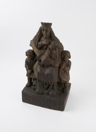 Wooden figure of Saint Blanche and three children