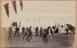 Men playing cricket at their camp