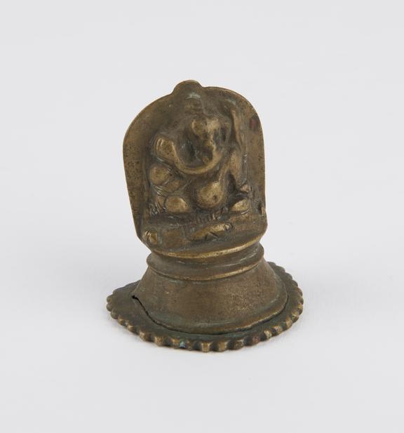 Hollow and worn brass plaque of the hindu elephant-god Ganesh