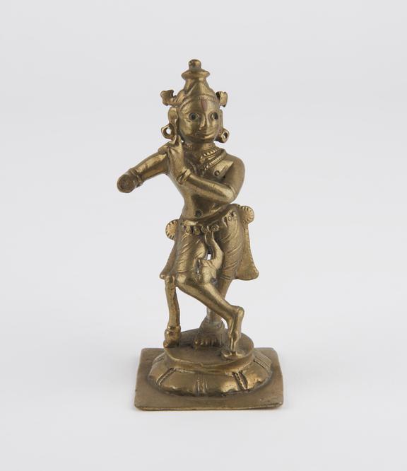 Statue of Krishna playing the flute, brass, South India