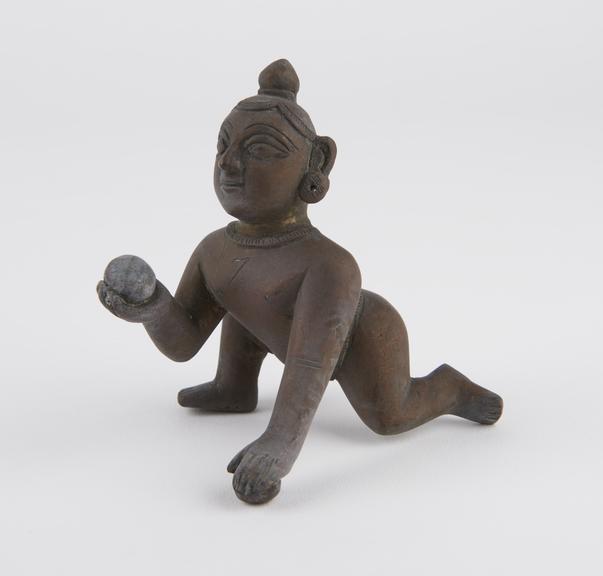 Statue of Krishna stealing butter, brass, India, 1801-1900