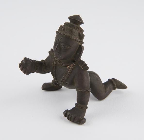 Brass figure of the hindu god Krishna as the butter thief