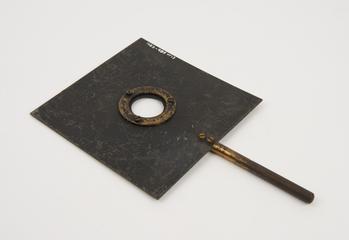 Square metal plate with circular hole fitted with clamping ring, on metal rod