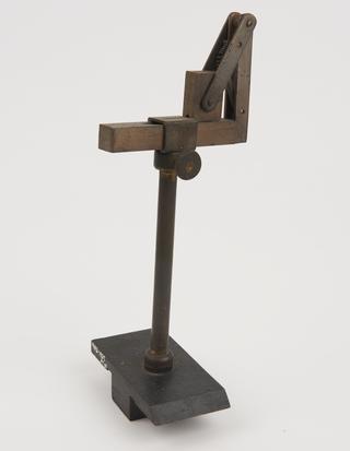 Sliding base to fit optical bench and support accessories