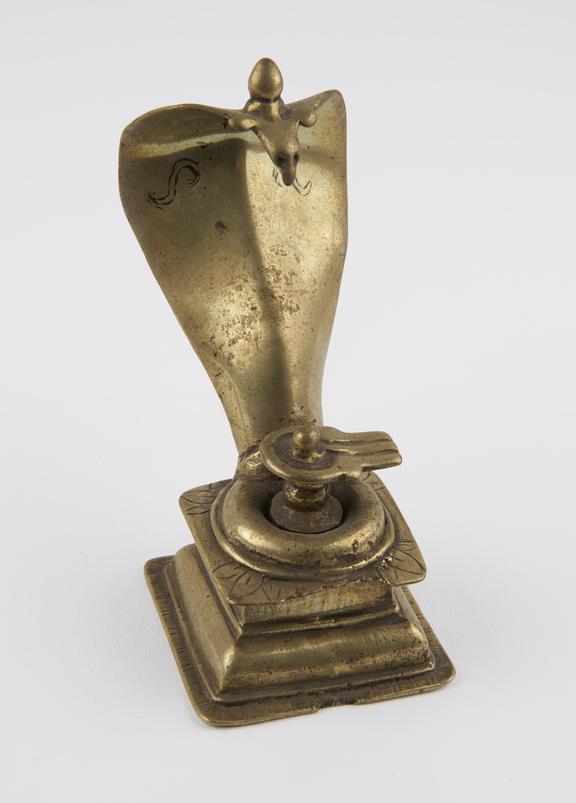 Hollow brass lingam, with cobra canopy