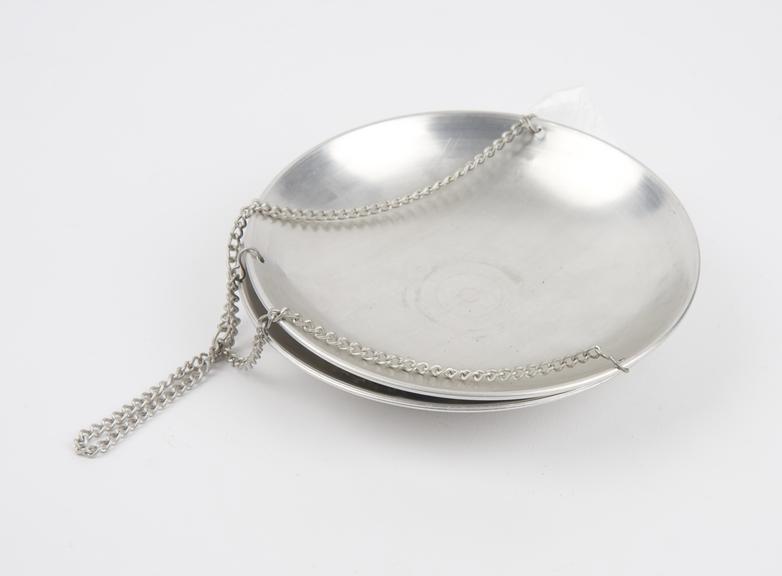 Two scale pans with chains by Griffin & George Ltd.