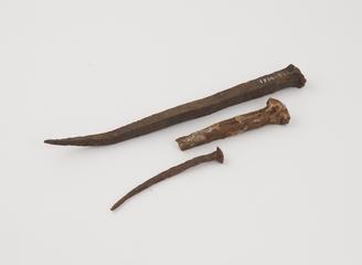 Three nails used in building