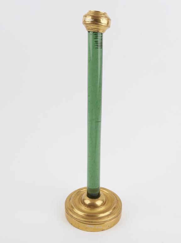 Insulating stand consisting of a green glass rod on a gilded