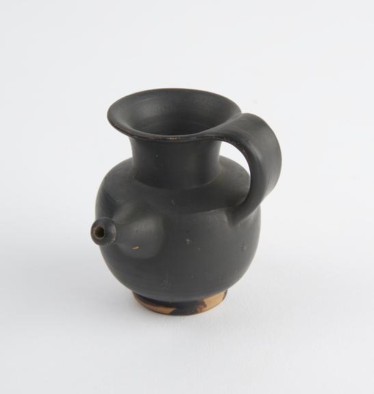 Pottery feeding cup, black glaze, Greek, from South Italy