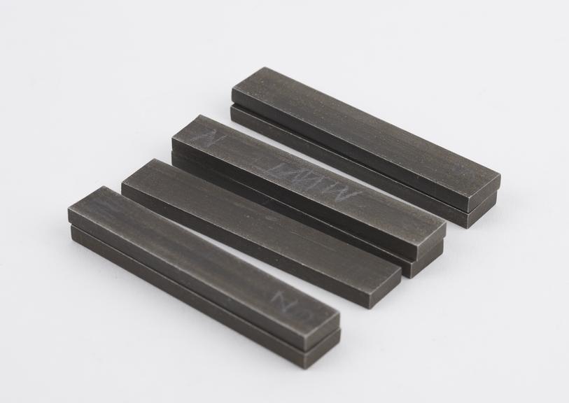 Four pairs of small steel magnets