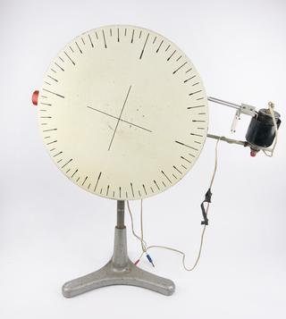 Optical demonstration disc, on tripod stand