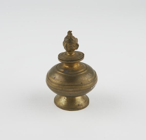 Squat bulbous bronze vessel on conical base